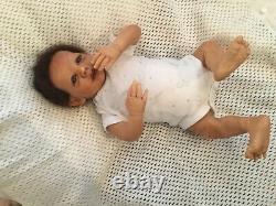 Beautiful black, mixed race reborn baby boy doll. Hand rooted hair. 19 ins