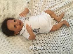 Beautiful black, mixed race reborn baby boy doll. Hand rooted hair. 19 ins