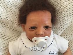 Beautiful black, mixed race reborn baby boy doll. Hand rooted hair. 19 ins