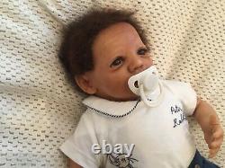 Beautiful black, mixed race reborn baby boy doll. Hand rooted hair. 19 ins