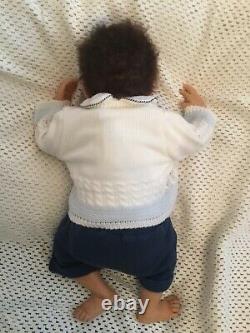 Beautiful black, mixed race reborn baby boy doll. Hand rooted hair. 19 ins