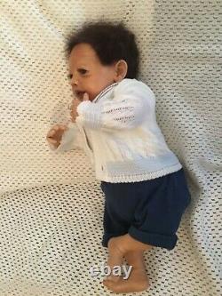 Beautiful black, mixed race reborn baby boy doll. Hand rooted hair. 19 ins