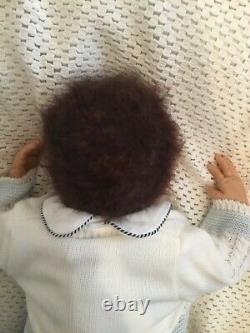 Beautiful black, mixed race reborn baby boy doll. Hand rooted hair. 19 ins