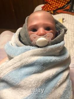 Hand painted reborn baby boy in perfect condition