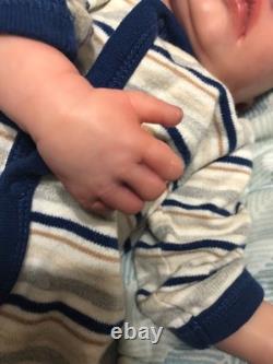 Hand painted reborn baby boy in perfect condition