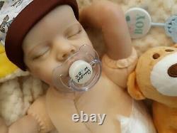 Reborn BABY 16 In takes a baby pacifier