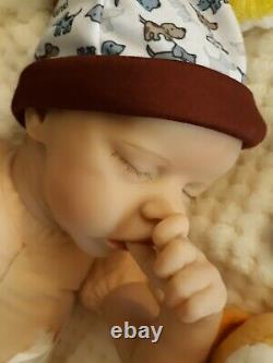 Reborn BABY 16 In takes a baby pacifier