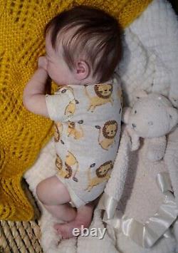 Reborn Doll. Ruby awake. Rooted hair and lashes full limbs acrylic eyes
