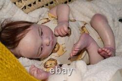 Reborn Doll. Ruby awake. Rooted hair and lashes full limbs acrylic eyes