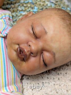 Reborn baby girl. Ethnic, African American, Bi racial. 23 inches