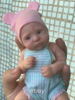 Reborn doll made of silicone. Mini baby newborn