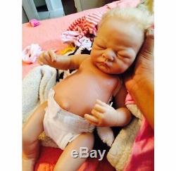 Reborn girl baby doll weighted, barely used, blonde hair